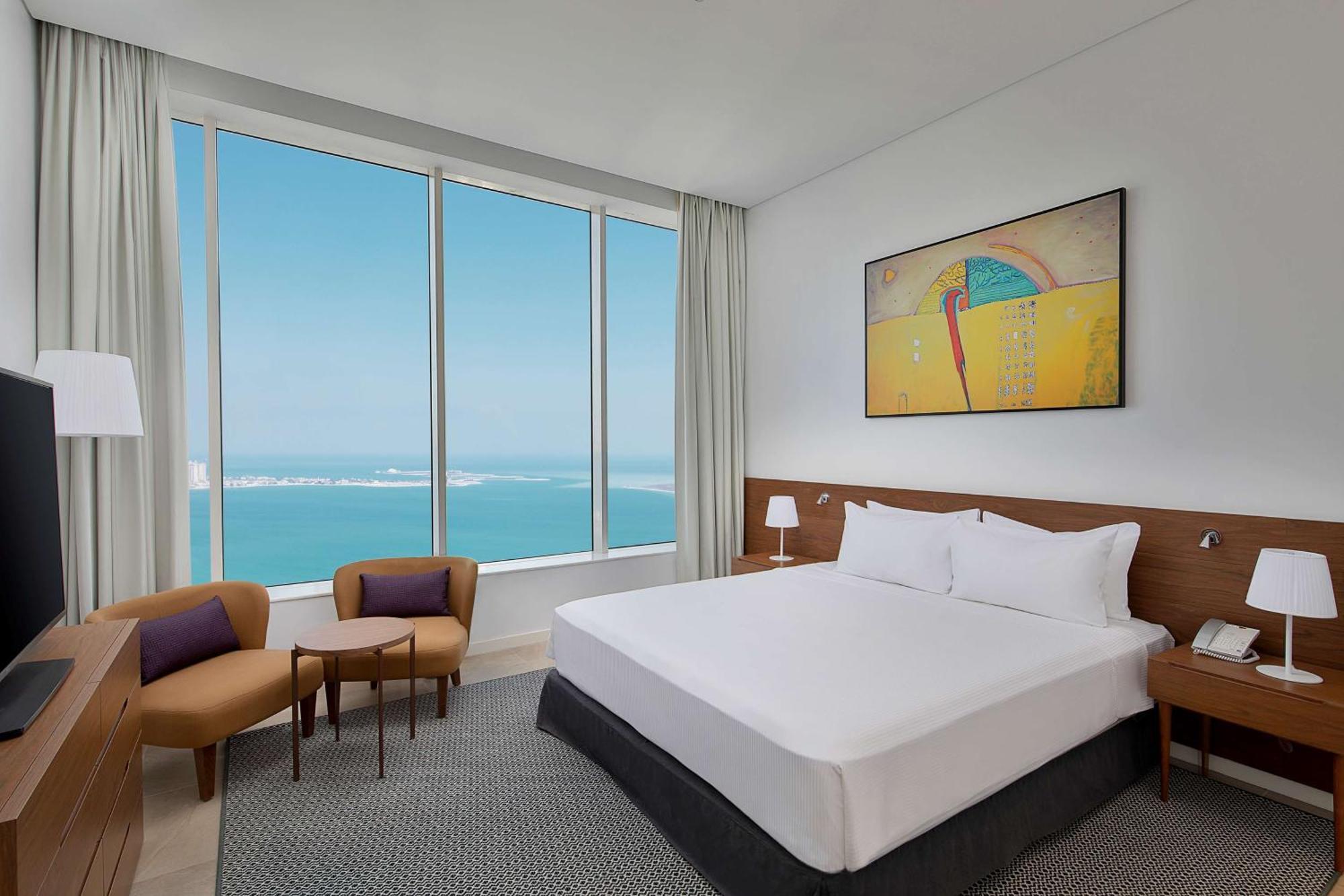 Aleph Doha Residences, Curio Collection By Hilton Exteriér fotografie A bedroom at the hotel