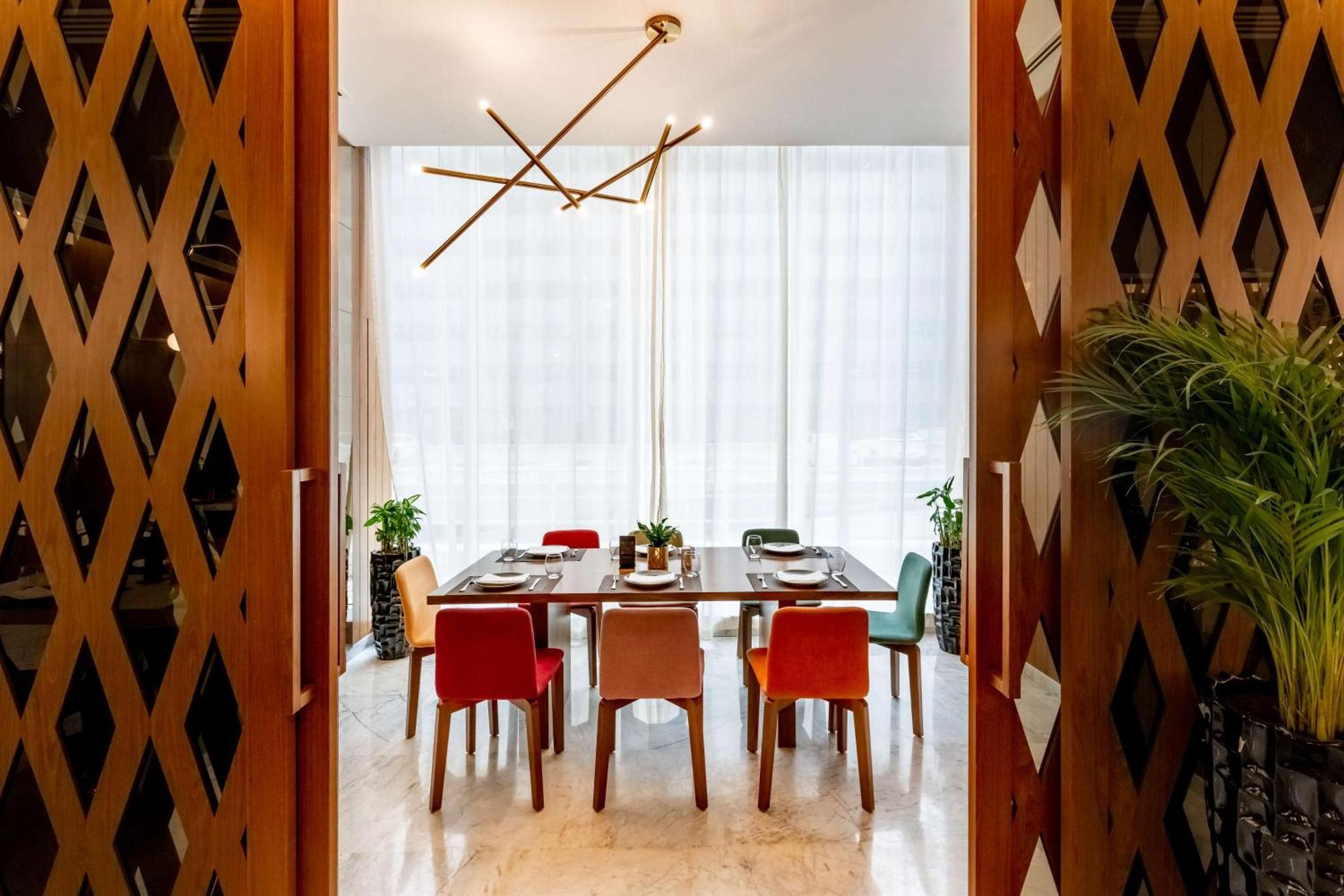 Aleph Doha Residences, Curio Collection By Hilton Exteriér fotografie Dining room
